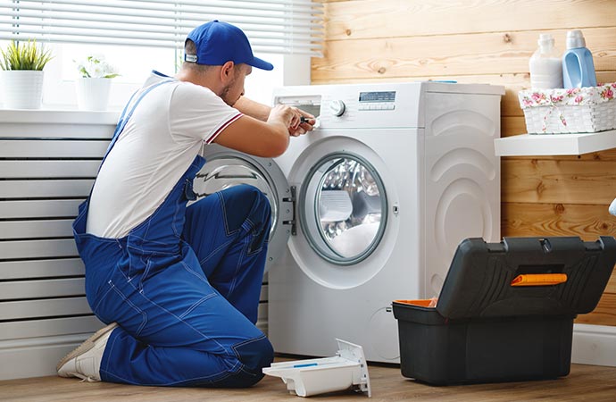 Repairing loose or damaged washing machine.
