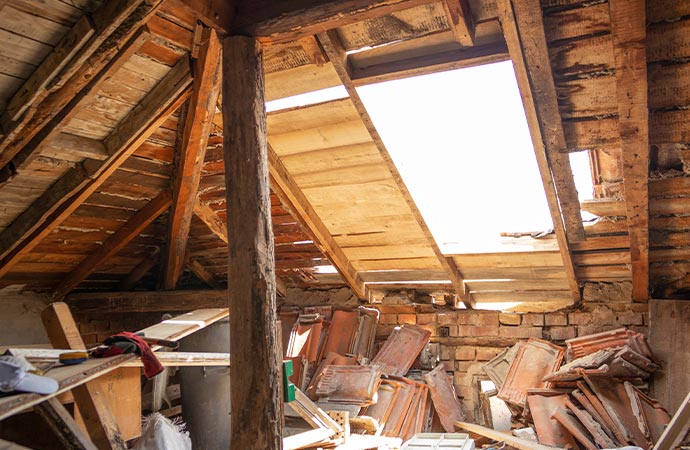 Broken roof causes attic water damage